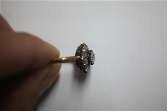 An early 20th century 18ct gold and diamond cluster ring, size K.